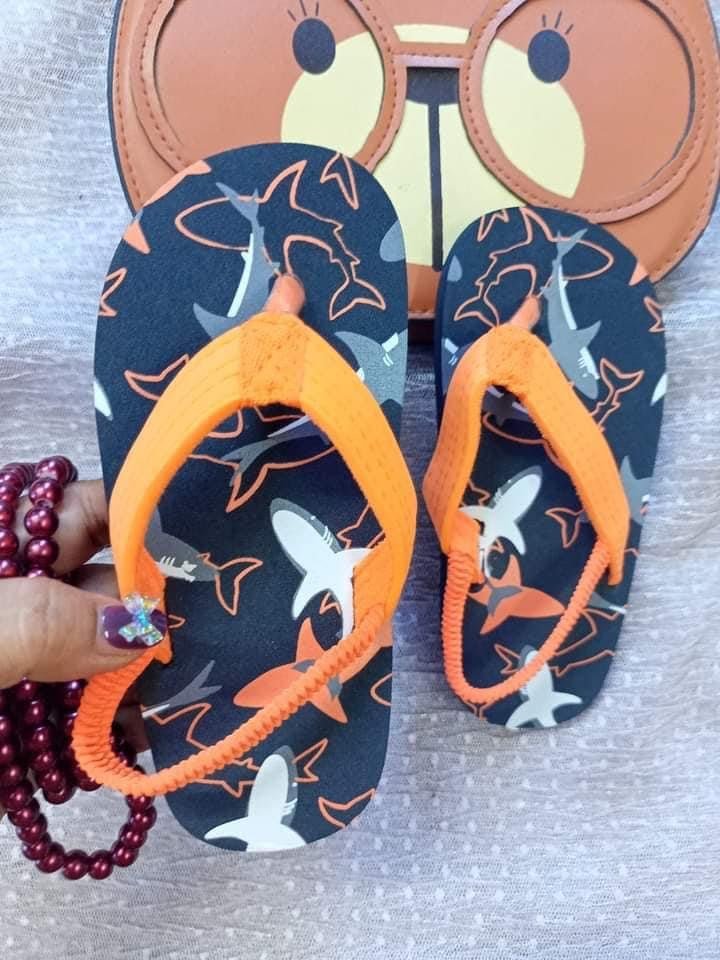 Kids’ printed EVA flip-flops in Orange